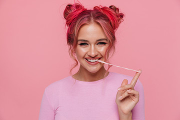 Portrait of happy young woman with colored hair stretching chewing gum - obrazy, fototapety, plakaty