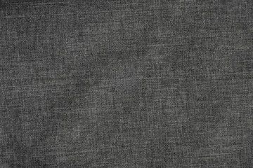 Fototapeta na wymiar Background of dense gray-black fabric with wicker texture