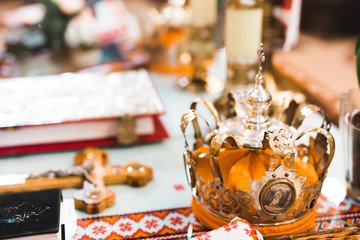 Fototapeta na wymiar Golden crown lying on the table in church