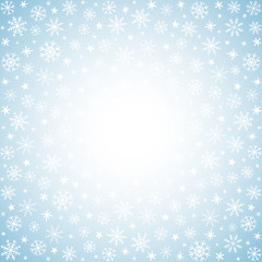 light winter background with hand drawn snow flakes