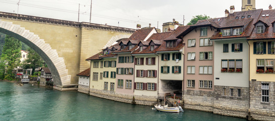 Fototapeta na wymiar Bern, Switzerland. Old city and Nydeggbrucke bridge over the Aare river