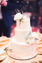 Obraz na płótnie Canvas Luxury decorated wedding cake on the table