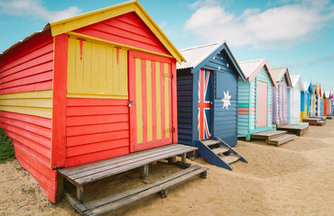 Fototapeta na wymiar Brighton beach colorful bathing boxes