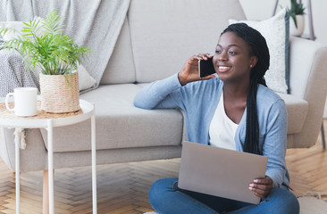 Freelance Career. Guy Talking On Cellphone Using Laptop Sitting On Floor At Home. Free Space For...