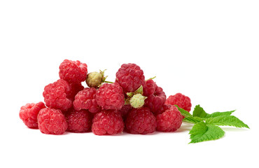 bunch of red ripe raspberries and green leaf on a white background