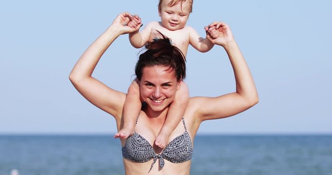 Baby boy on mom s shoulders