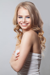 Obraz premium Beautiful happy woman smiling on white