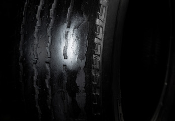 Damage tire on black background with copy space for text or image