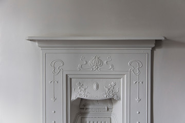 Victoriran cast iron fireplace surround with white walls