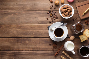 cup of coffee and beans on wooden background