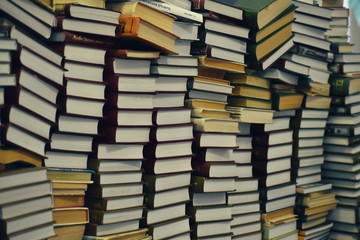Large stacks of books in the library.