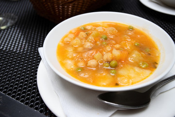 Potaje Canario,  delicious vegetable soup of Canary Island and popular dish at the menu of Guanchiche - local authentic restaurant. Lifestyle image.