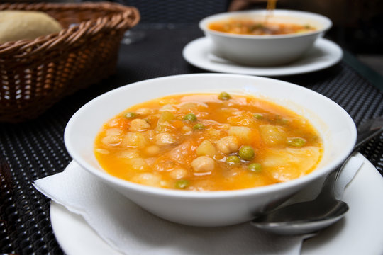 Potaje Canario,  delicious vegetable soup of Canary Island and popular dish at the menu of Guanchiche - local authentic restaurant. Lifestyle image.