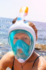 Portrait of a young girl diver on a sunny day.