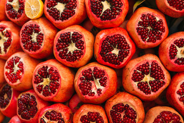 Photo of Grenades on the supermarket shelf. Pomegranates on the street market