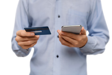 Man holding smatrphone and credit card, shopping online