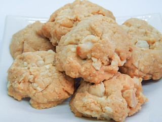 Portion of Macadamia Cookies on White background. Pile of macadamia nut cookies.
