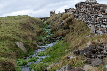 stream dry stone wall
