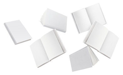 Flying blank white hard cover books, isolated on white background