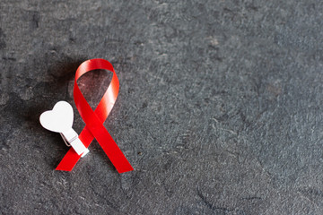 World aids day December 1 with red ribbon, campaign help people with living with HIV.