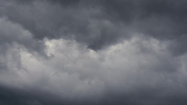 Dark stormy clouds swirl over a sea of despair in a forbidding pattern            