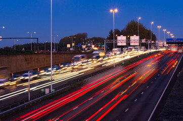 Evening rush hour on the motorway near the Gouwe aquaduct (Gouda, A12) in the Netherlands. Long shutter/exposure speed image.