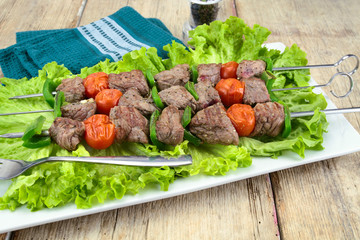 beef skewer on a plate