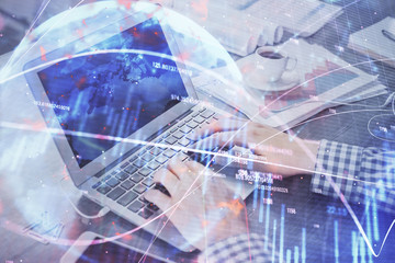 Double exposure of forex chart with man working on computer on background. Concept of market analysis.