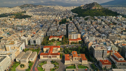 Aerial drone video of trilogy neoclassic buildings, Academy of Athens, University and public...