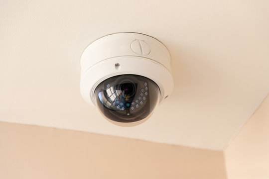 security home camera, CCTV 360 degree on white ceiling.
