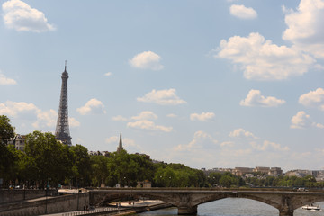 Fototapeta na wymiar Clouds over world famous Seine river and Eiffel tower in Paris