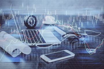 Financial market graph hologram and personal computer on background. Multi exposure. Concept of forex.
