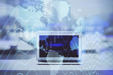 Forex graph hologram on table with computer background. Multi exposure. Concept of financial markets.