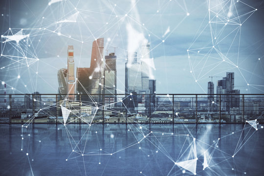 Technology theme hologram with city view from roof background. Double exposure. - Powered by Adobe