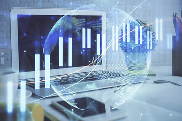 Stock market chart hologram drawn on personal computer background. Multi exposure. Concept of investment.