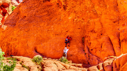 Practicing Repelling and Climbing on the Red Sandstone Mountains at the Guardian Angel Trail in Red...