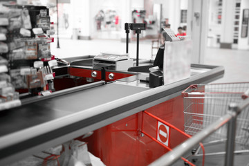 Empty cash desk with closed way border in supermarket