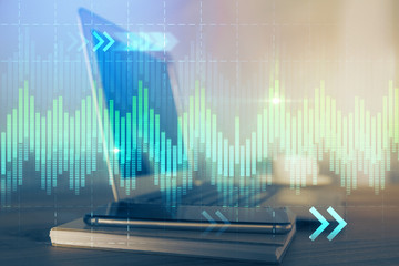 Financial market graph hologram and personal computer on background. Multi exposure. Concept of forex.