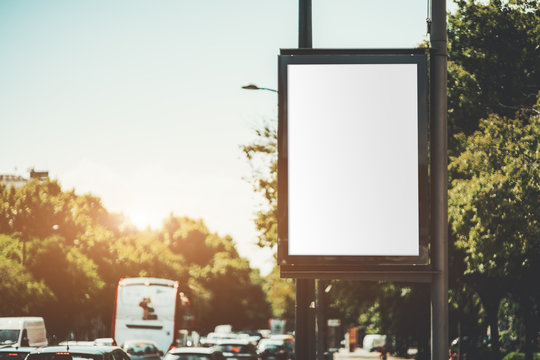 Mock-up Of An Empty Advertising Banner Over A Highway; A Blank Vertical Street Poster Template On In Urban Setting During Traffic Jam; An Outdoor Billboard Placeholder Mockup Near A Road With Cars