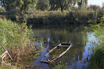 Sunken boat in Danube–Tisa–Danube canal.