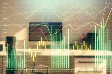 Stock market chart and desktop office computer background. Multi exposure. Concept of financial...