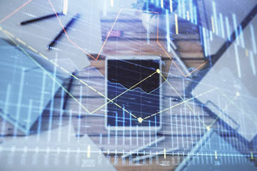 Fototapeta na wymiar Double exposure of forex graph on digital tablet laying on table background. Concept of market analysis