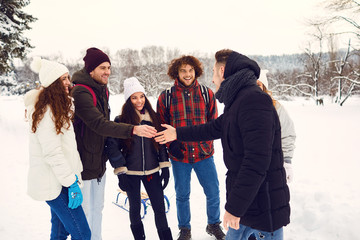 Happy friends meeting in winter park