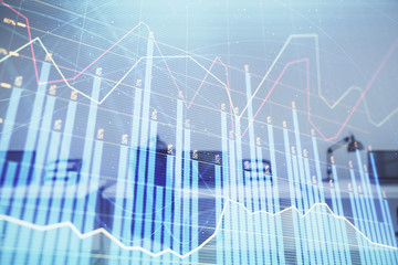 Stock and bond market graph with trading desk bank office interior on background. Multi exposure. Concept of financial analysis