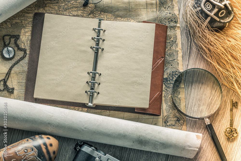 Aufkleber Journey.  Notebook with space for text.  Souvenirs and things related to travel and exploring the world.