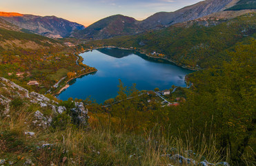 Panoramic view of Scanno lake at sunrise, the most striking feature is, of course, its unique heart shape. Rich in fish, fauna, and wildlife