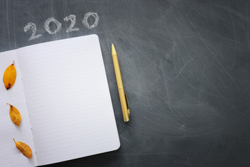 Business concept, top view of blackboard with the phrase 2020 goals