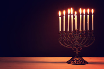 Religion image of jewish holiday Hanukkah background with menorah (traditional candelabra) and candles