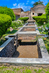 Exploring the houses and streets of the ancient city of Pompeii which is an ancient Roman city near Naples Italy that was  destroyed by  the eruption of Mount Vesuvius