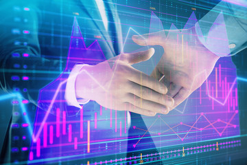 Multi exposure of forex graph on abstract background with two businessmen handshake. Concept of success on stock market